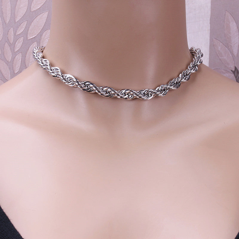 Twisted rope chain choker worn at the throat