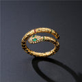 The Coilbound serpent wrap ring in gold tone with zircon accents