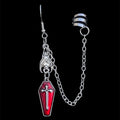 Silver ear cuff and chain with coffin charm, product view on black background