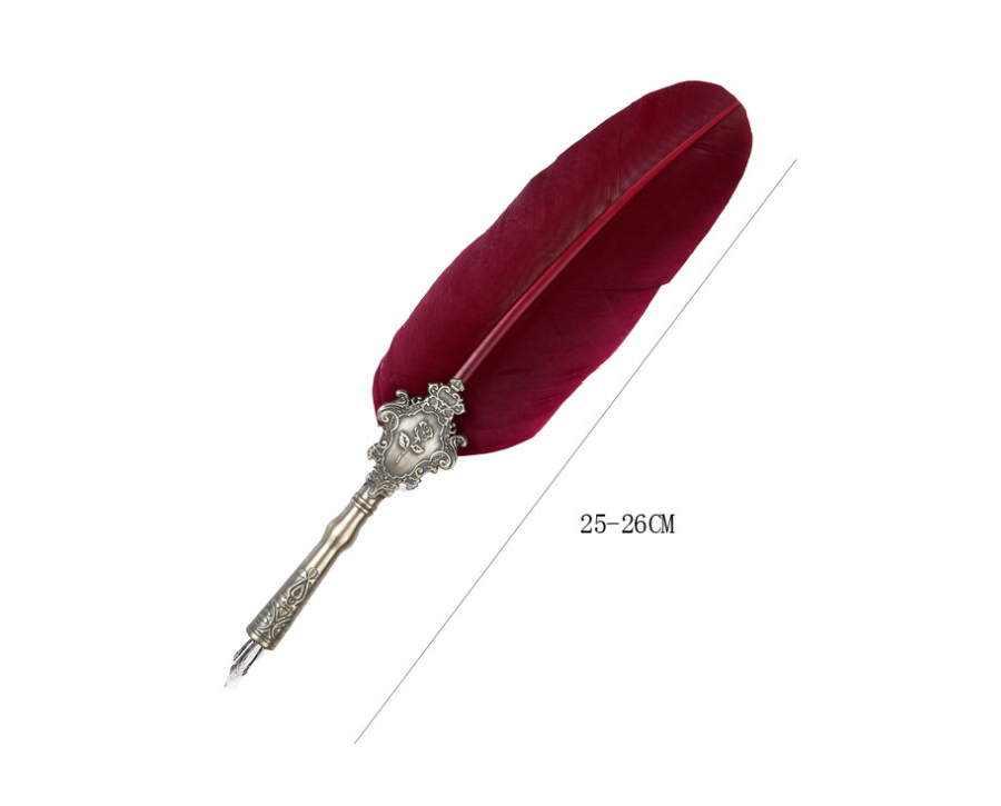 Close-up of the black feather quill's antique-silver rose-relief grip on a plain background
