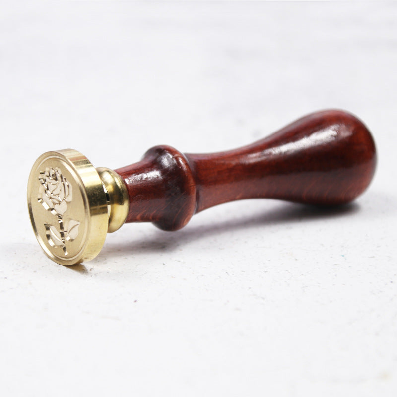 Detail of the brass seal head and wooden handle