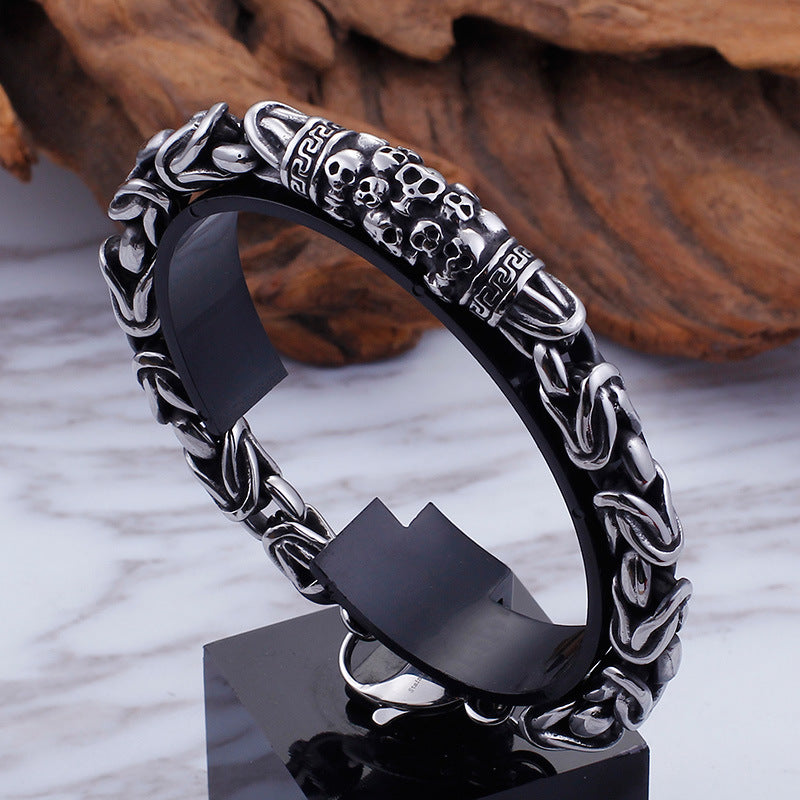 Braided skeleton-link stainless steel bracelet on display stand