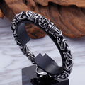 Braided skeleton-link stainless steel bracelet on display stand