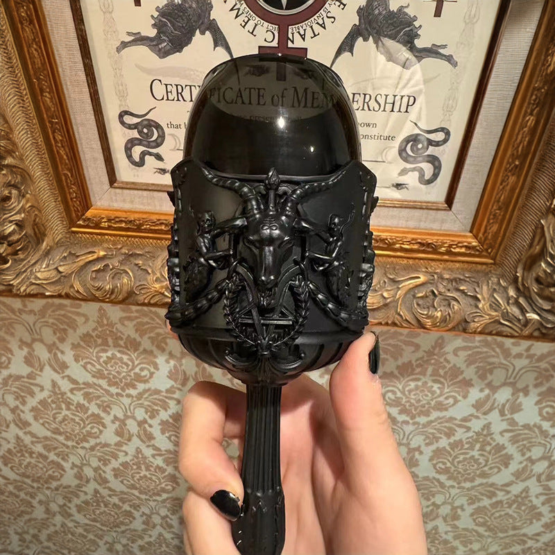 Close-up of the Bonecup goblet's horned skull relief and chain detail