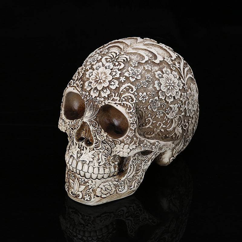 Floral-carved gothic skull statue in aged ivory resin, memento mori decor