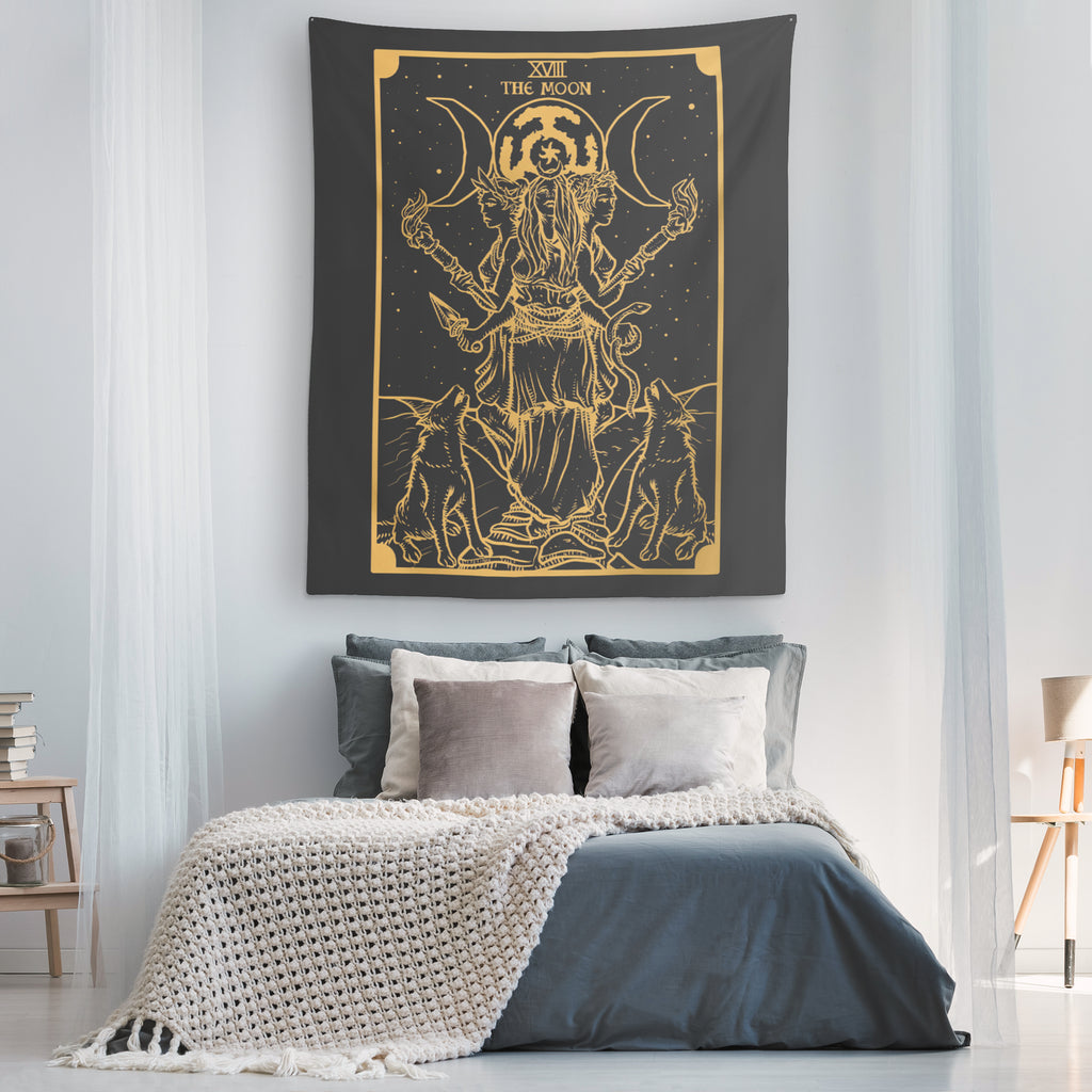Wide view of the black and gold Hecate moon goddess tapestry as a bedroom wall hanging