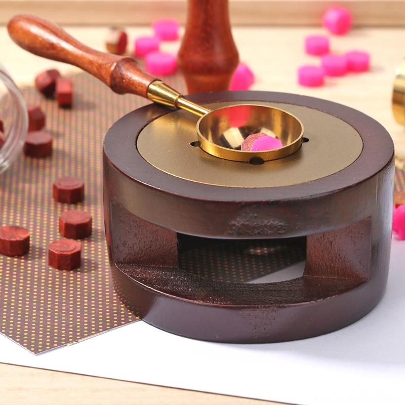 The Waxwarden furnace in use with wax beads and a melting spoon (spoon and wax sold separately)