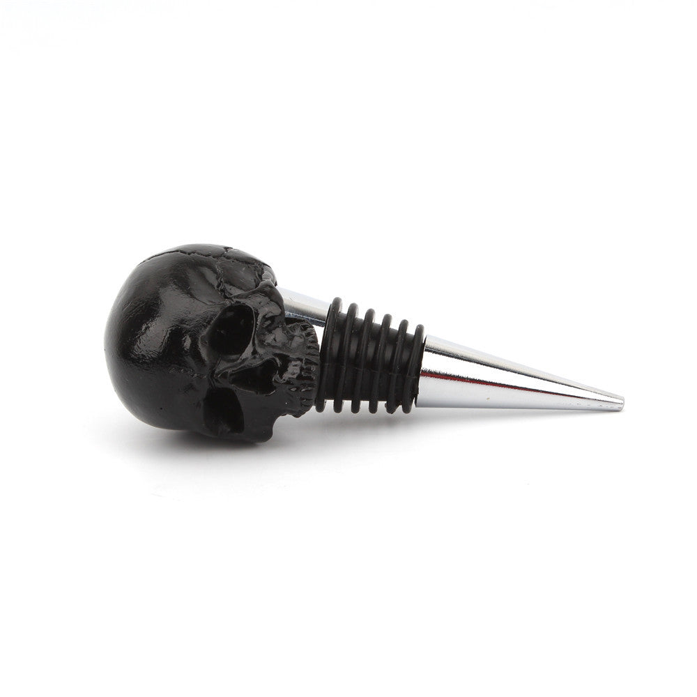 Black skull bottle stopper side angle showing spike and collar detail