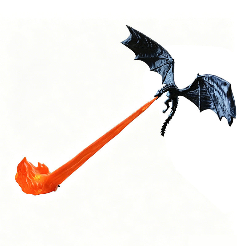 Black dragon flame sculpture with orange fire column on white background