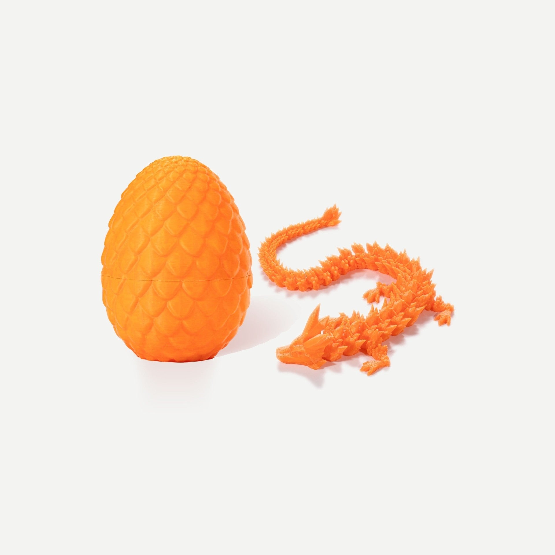 Orange crystal resin dragon egg with matching articulated orange gemstone dragon