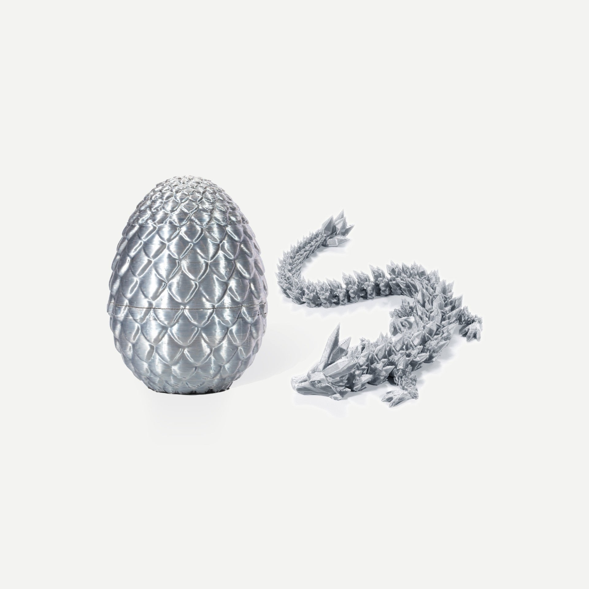 Silk silver crystal resin dragon egg with matching articulated silver dragon