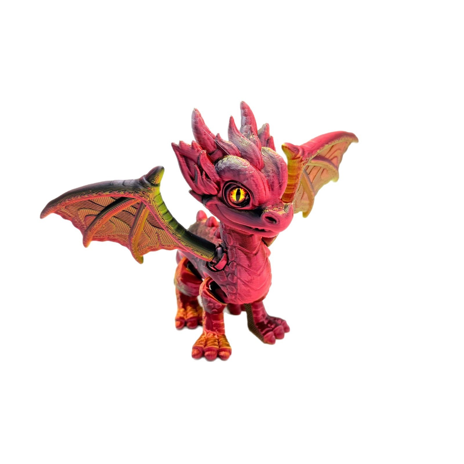 Red and gold posable 3D-printed baby dragon figurine with amber serpent eye, wings spread