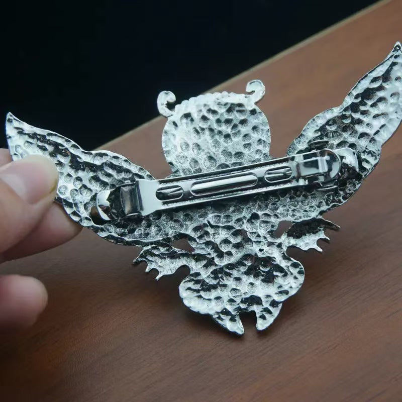 Antique silver Celtic knotwork owl hair fork, back view showing spring-clip mechanism