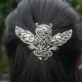 Antique silver Celtic knotwork owl hair fork worn in dark hair