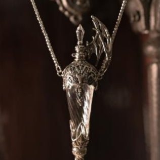 Winged glass vial pendant with dark filigree cap, full chain view