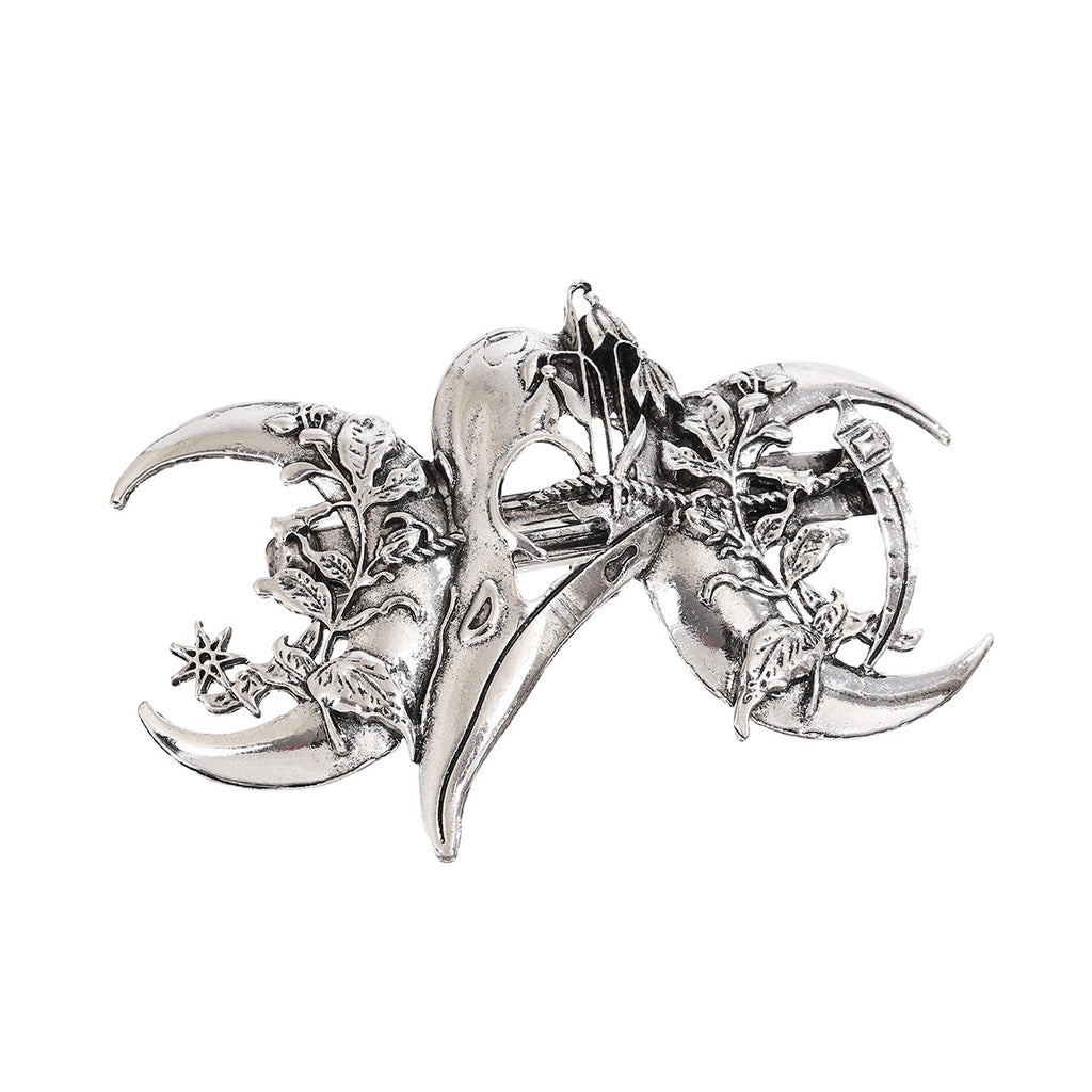Antique silver raven skull hair clip with crescent moons and ivy vine detail, studio shot