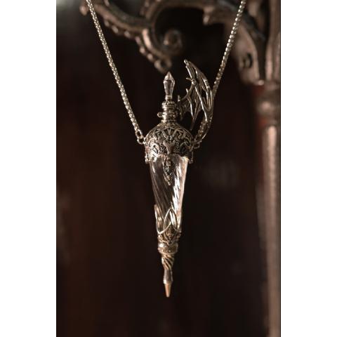 Vial pendant close-up showing the wing and filigree detail