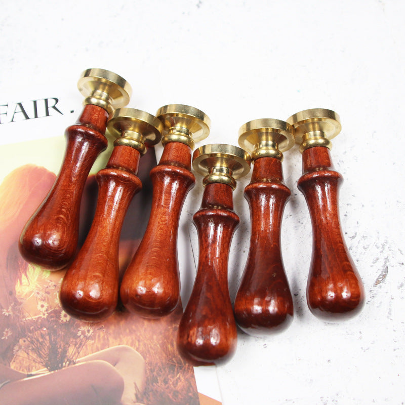 Collection of wax seal stamps with wooden handles