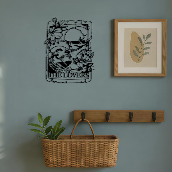 The Lovers skeleton tarot metal wall plaque hung in an entryway