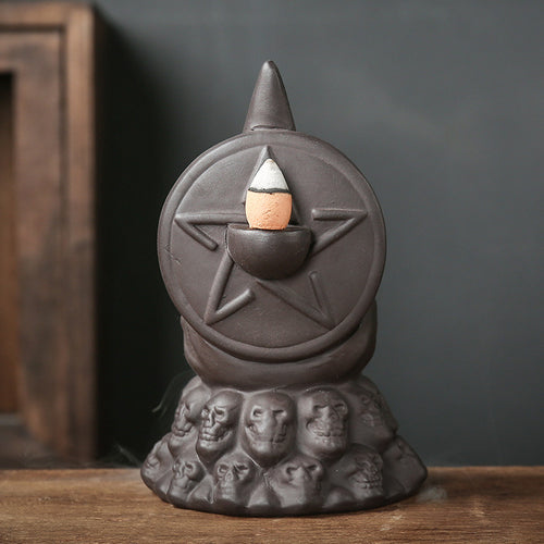 Skull backflow incense burner smoke pouring downward
