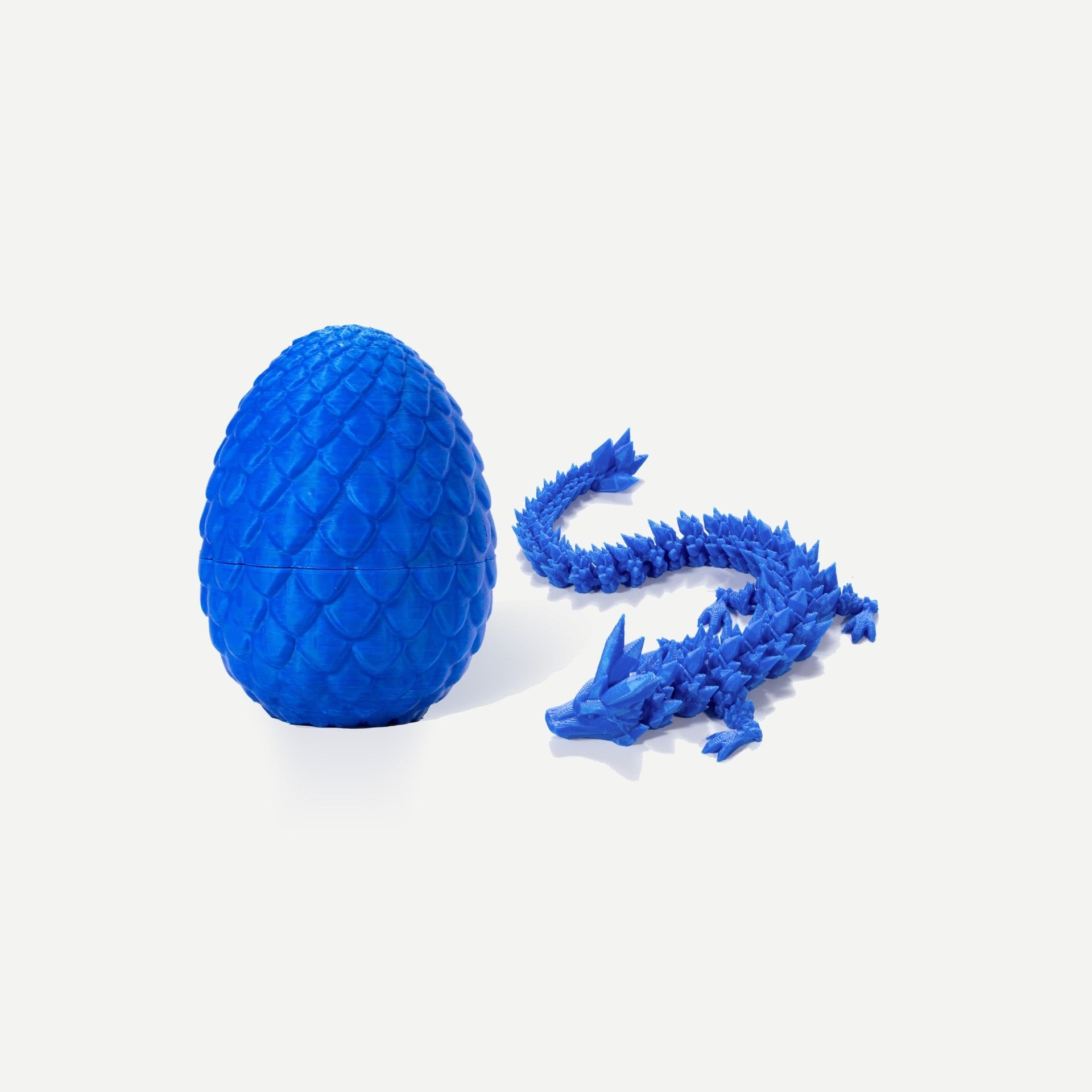 Blue crystal resin dragon egg with matching articulated blue gemstone dragon